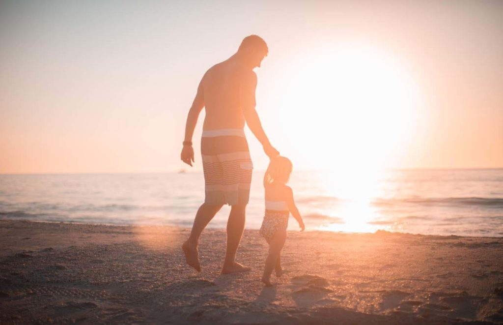 father and son on a beach