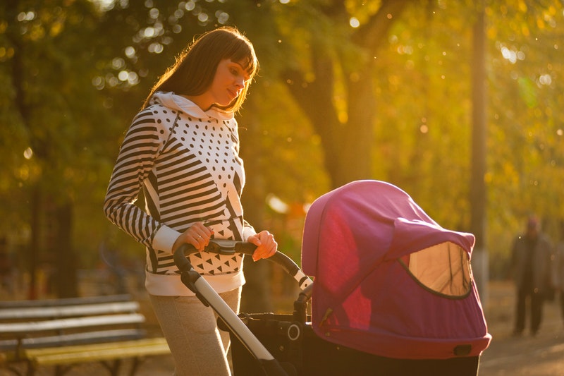 woman holding pink and black baby stroller, residential treatment facilities los angeles, LA addiction treatment