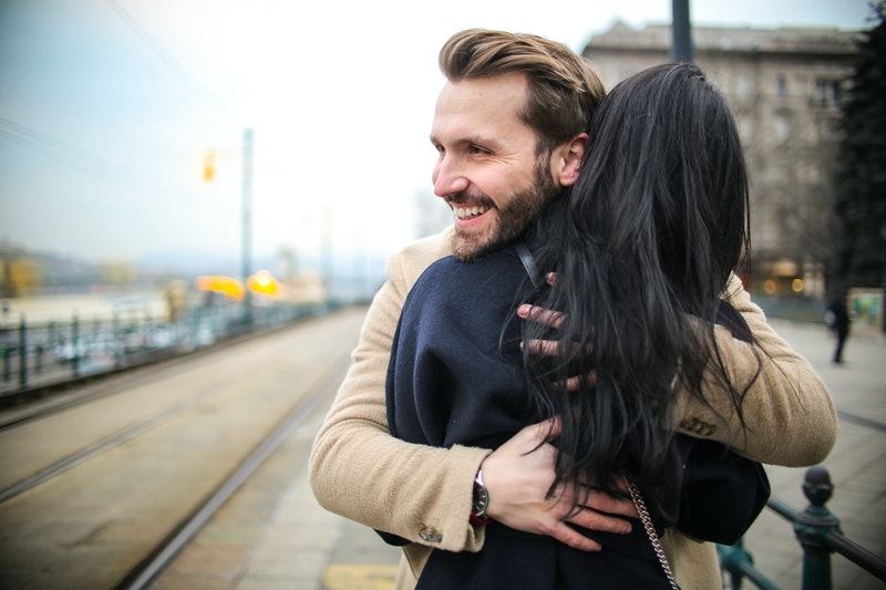 photo of a man hugging a woman, how to help girlfriend with anxiety, how can you help someone with anxiety