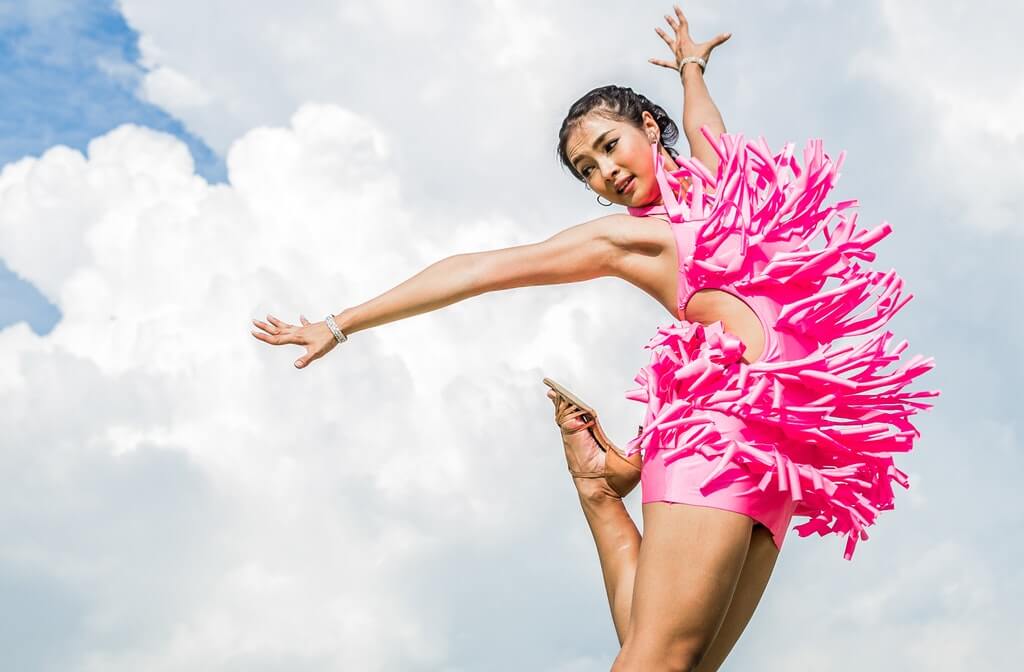 Novo Detox LA| a photo of a woman in a pink dress doing a jump shot, suboxone addiction therapy, is suboxone more addictive than hydrocodone